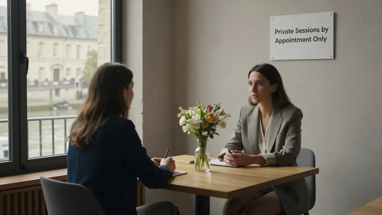 A professional meeting in a private co-working space in Paris, with flowers between two people, natural light, and the Seine visible outside.